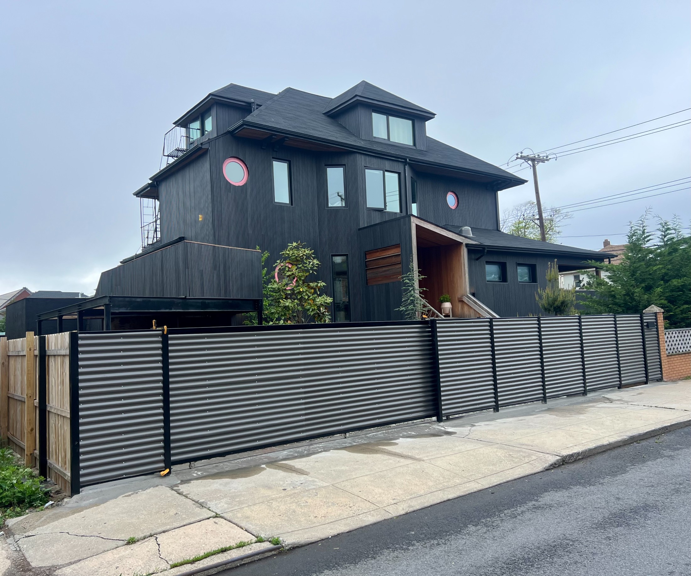 Rockaway Park beach house — Victorian three-family remade as a modern black-clad residence