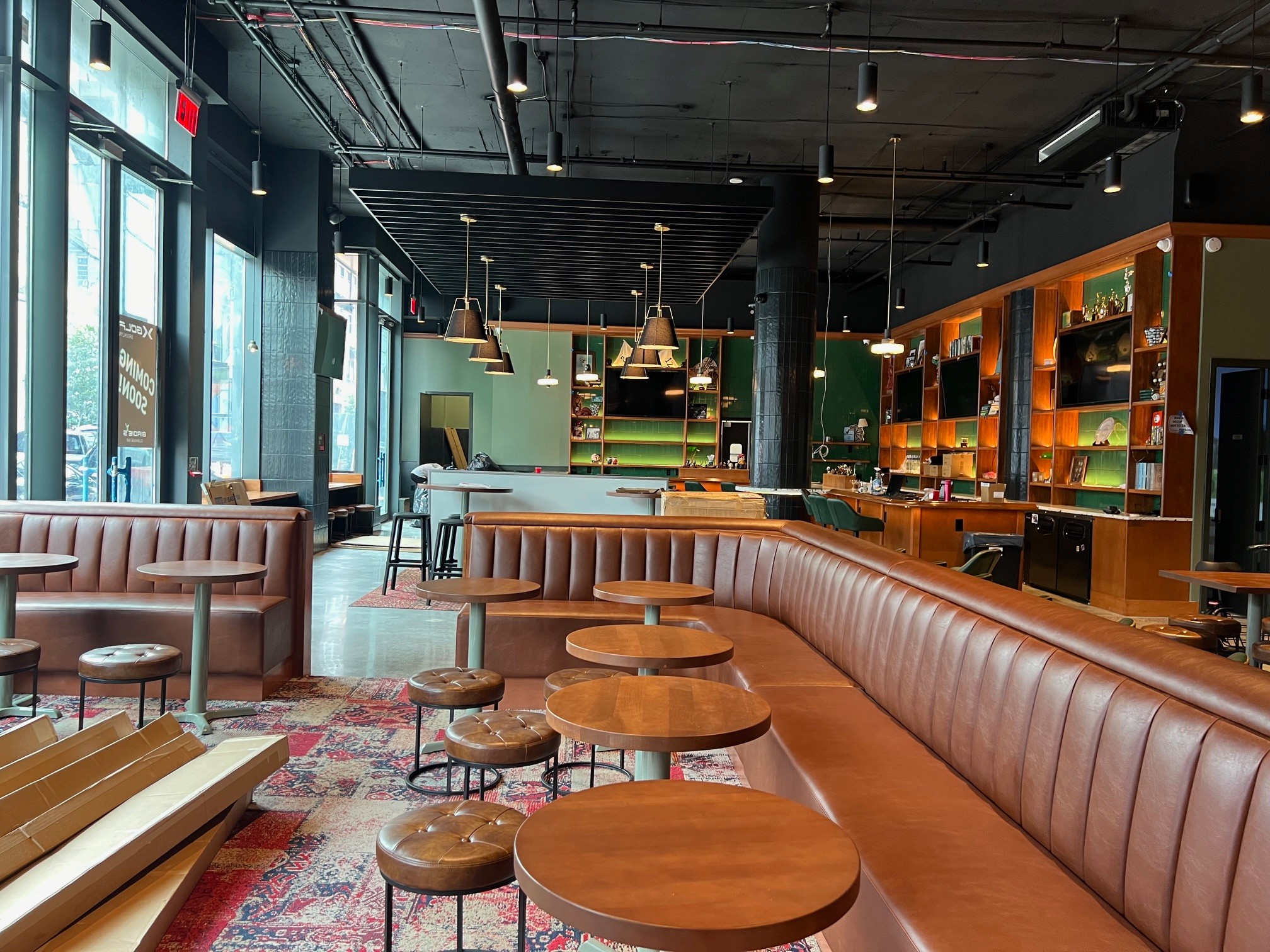 X-Golf Brooklyn — the finished bar and lounge of a 20,000 SF industrial-to-hospitality conversion by PRYM